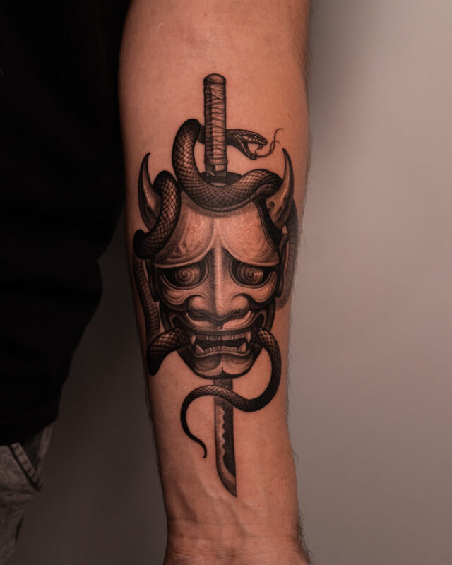 Black and grey Hannya mask and snake tattoo in Hanoi by Azone Tattoo Studio