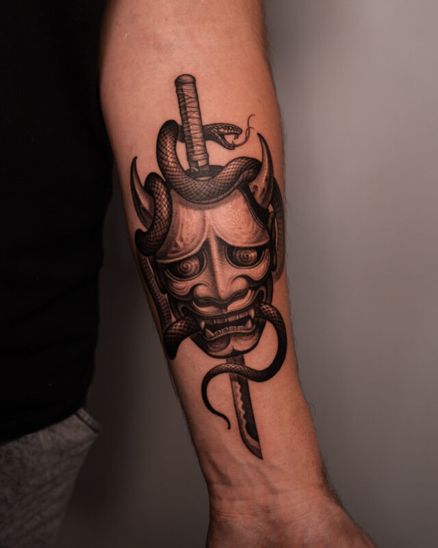 Blackwork Hannya snake and katana tattoo by Azone Tattoo Studio