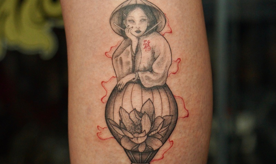Lotus and vietnamese symbolic tattoo