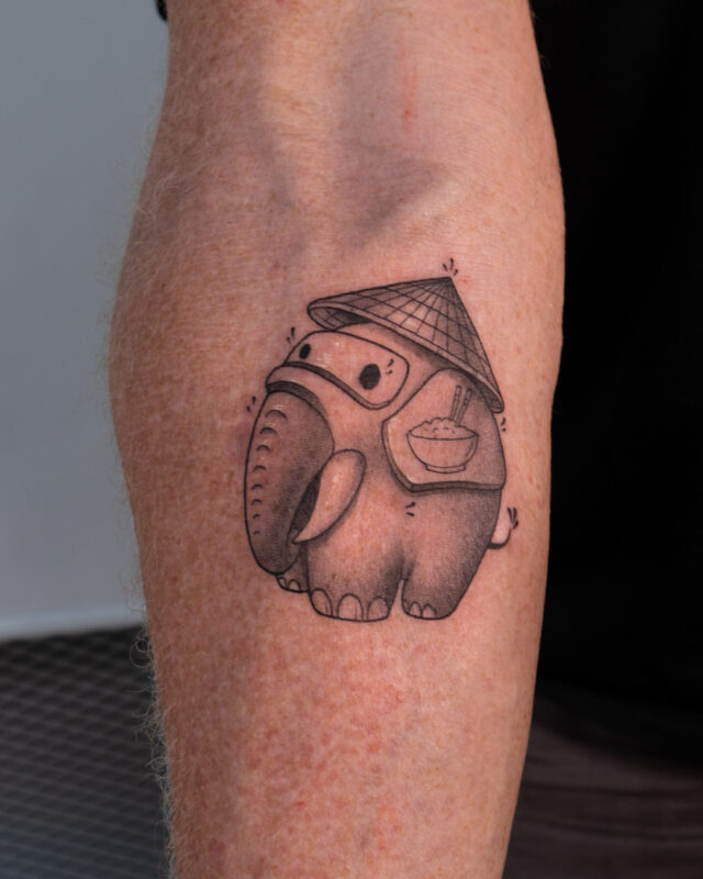 Vietnamese elephant tattoo with conical hat in Hanoi by Azone Tattoo Studio