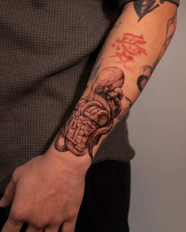 Black and grey octopus and treasure chest tattoo in Hanoi by Azone Tattoo Studio