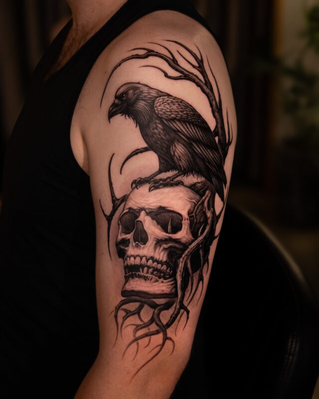 Black and grey raven and skull tattoo in Hanoi by Azone Tattoo Studio