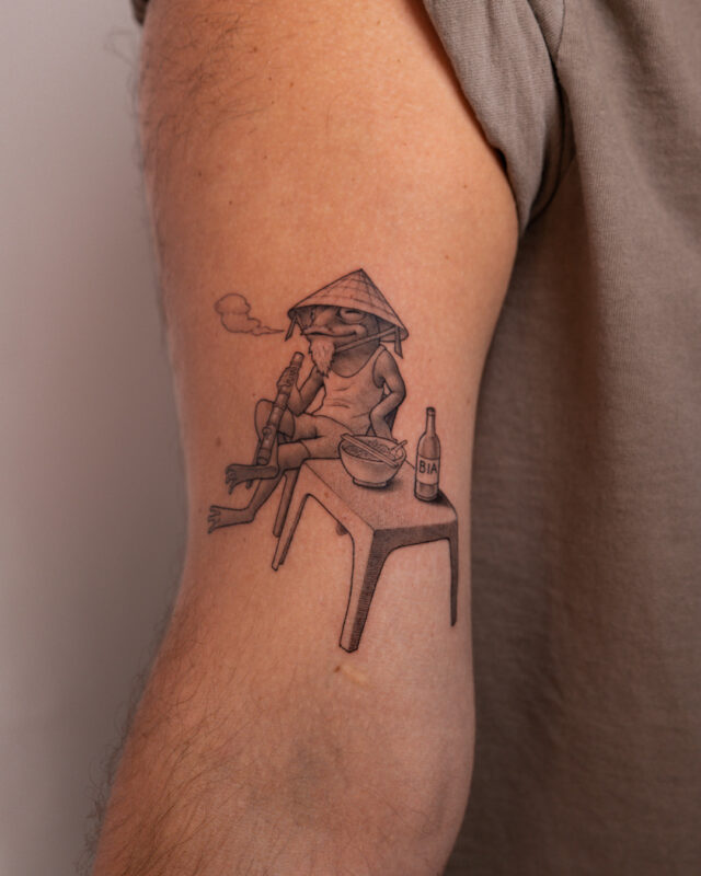 Vietnamese frog tattoo eating pho in Hanoi by Azone Tattoo Studio