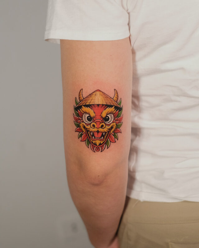 Vietnamese lion dance mask tattoo in Hanoi