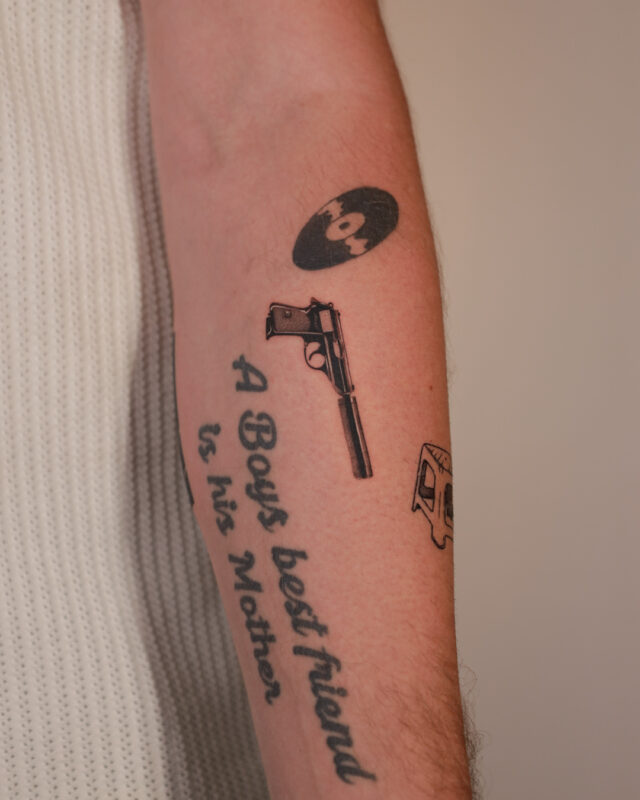 Blackwork pistol tattoo in Hanoi by Azone Tattoo Studio