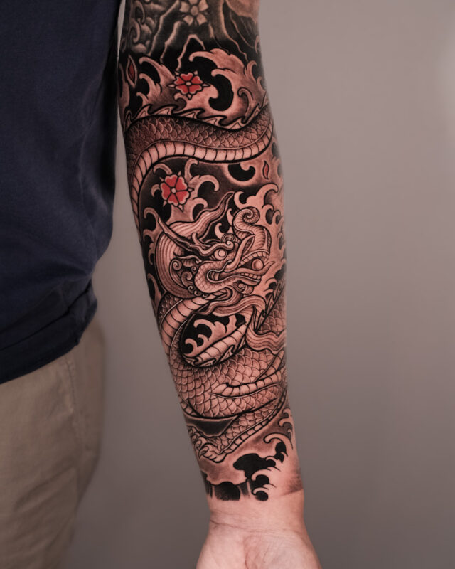 Black and grey dragon tattoo sleeve in Hanoi by Azone Tattoo Studio