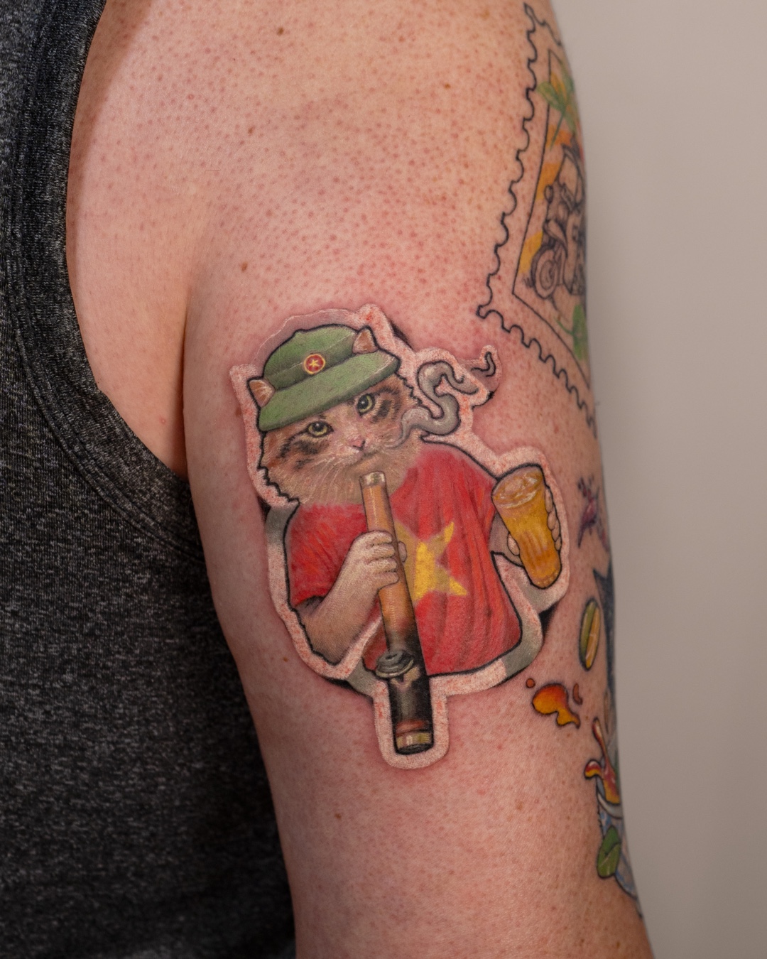 Custom Vietnamese-inspired cat tattoo by Azone Tattoo Studio.