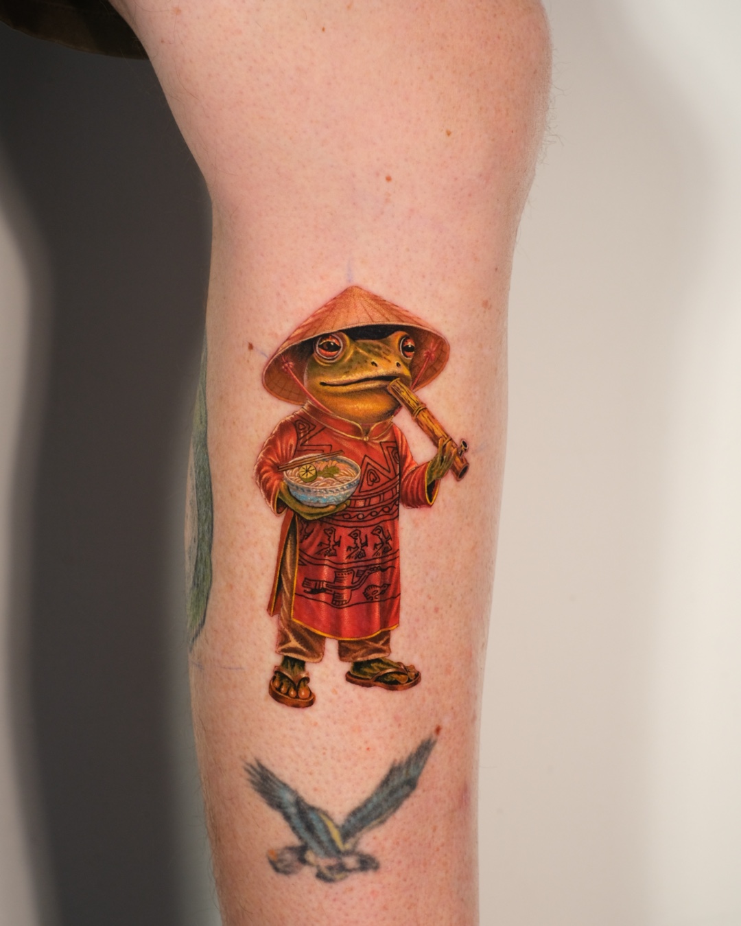 Vietnamese culture tattoo featuring a frog inspired by Vietnamese everyday life