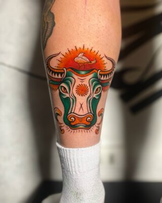 Vietnamese folk buffalo tattoo by Azone Tattoo Studio