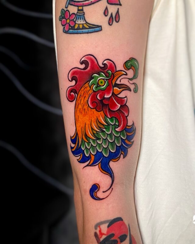 Vietnamese folk-inspired rooster tattoo