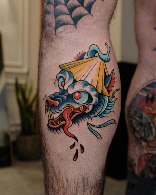 Vietnamese-inspired wolf tattoo with conical hat